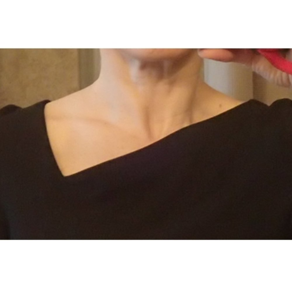 Dramatic designer top with asymmetric neckline